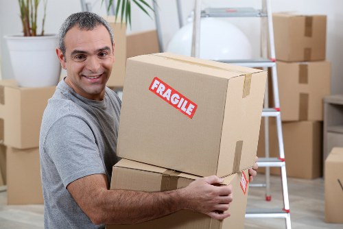 Professional man and van moving furniture in Stmargarets